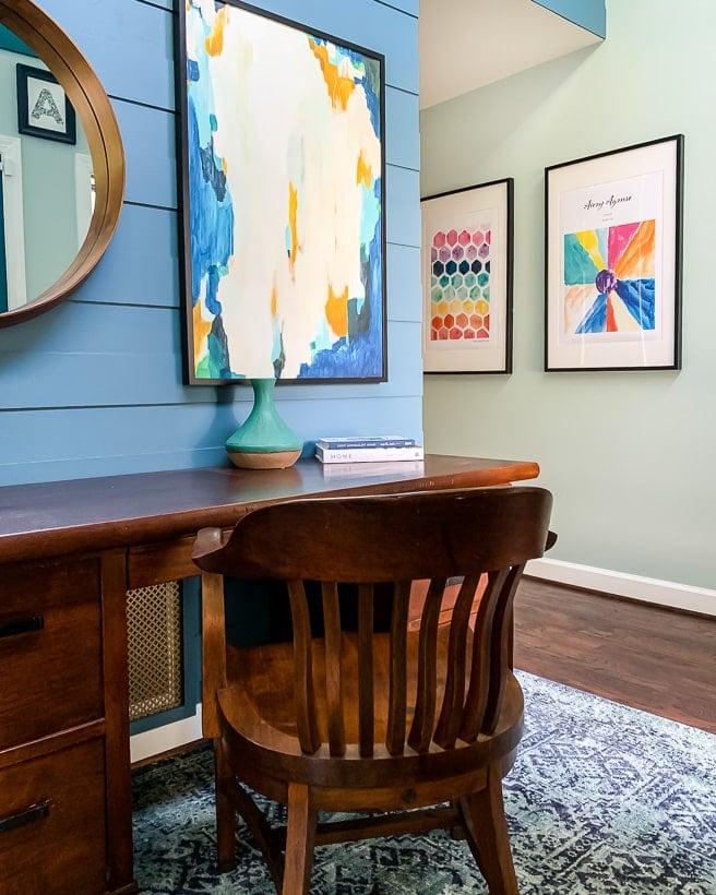 foyer with colorful rug and art