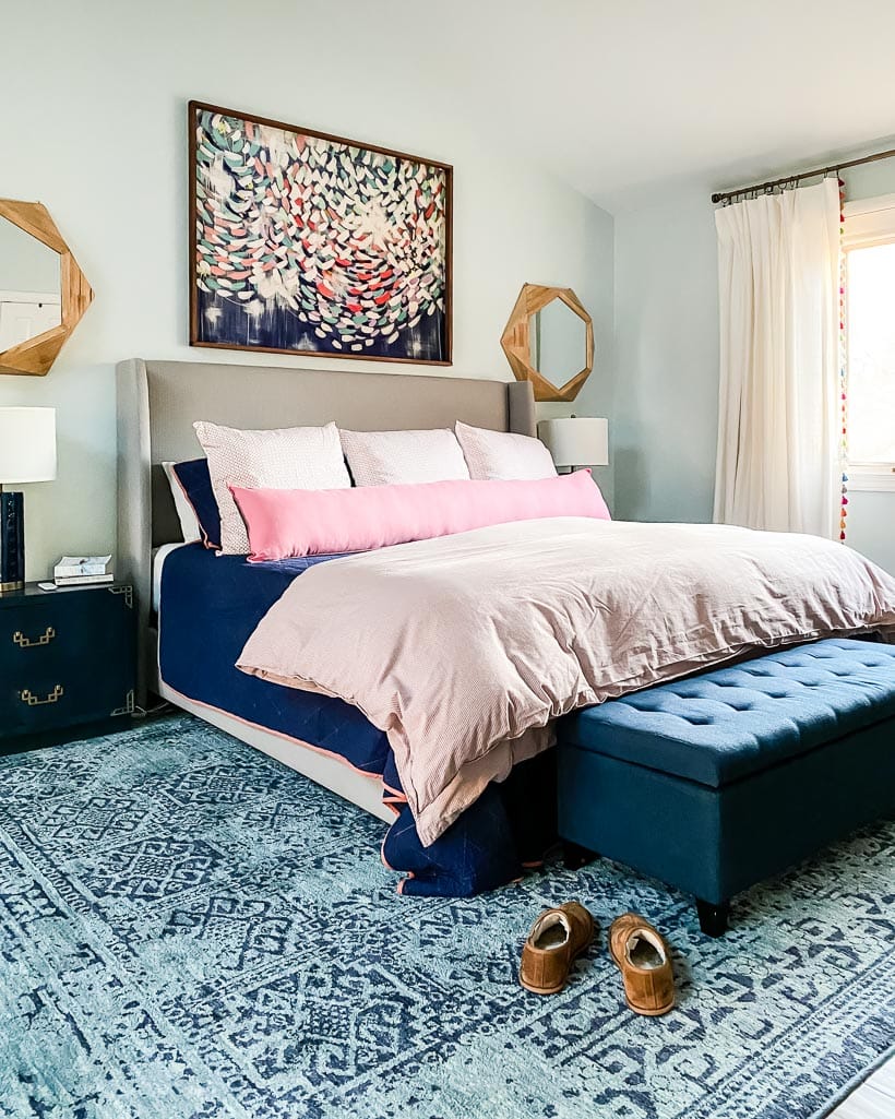 master bedroom with colorful rug