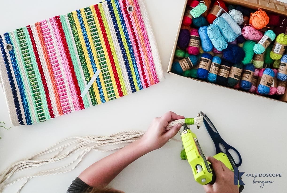 hot glue gun on DIY macrame plant hanger