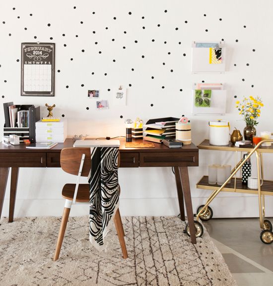 office space with fun dots and a bar cart