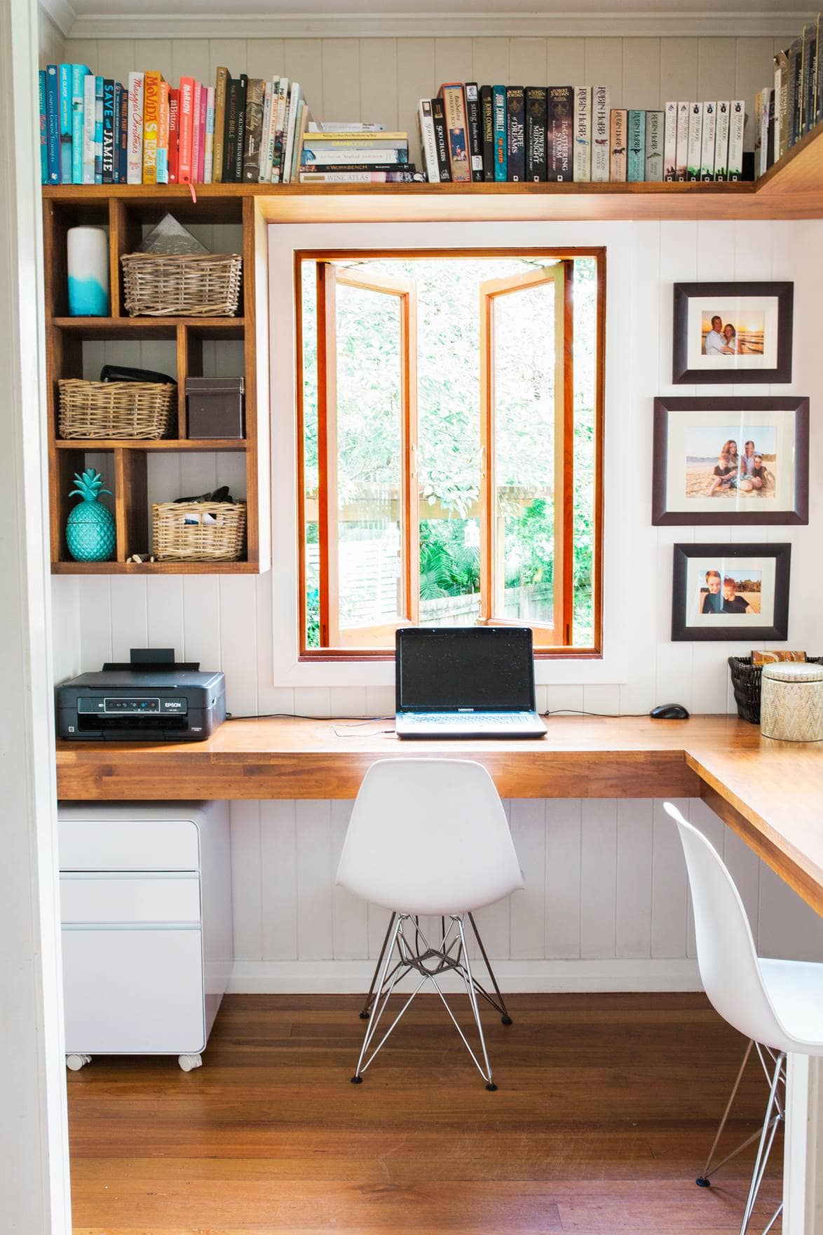 corner office with a window and shelves