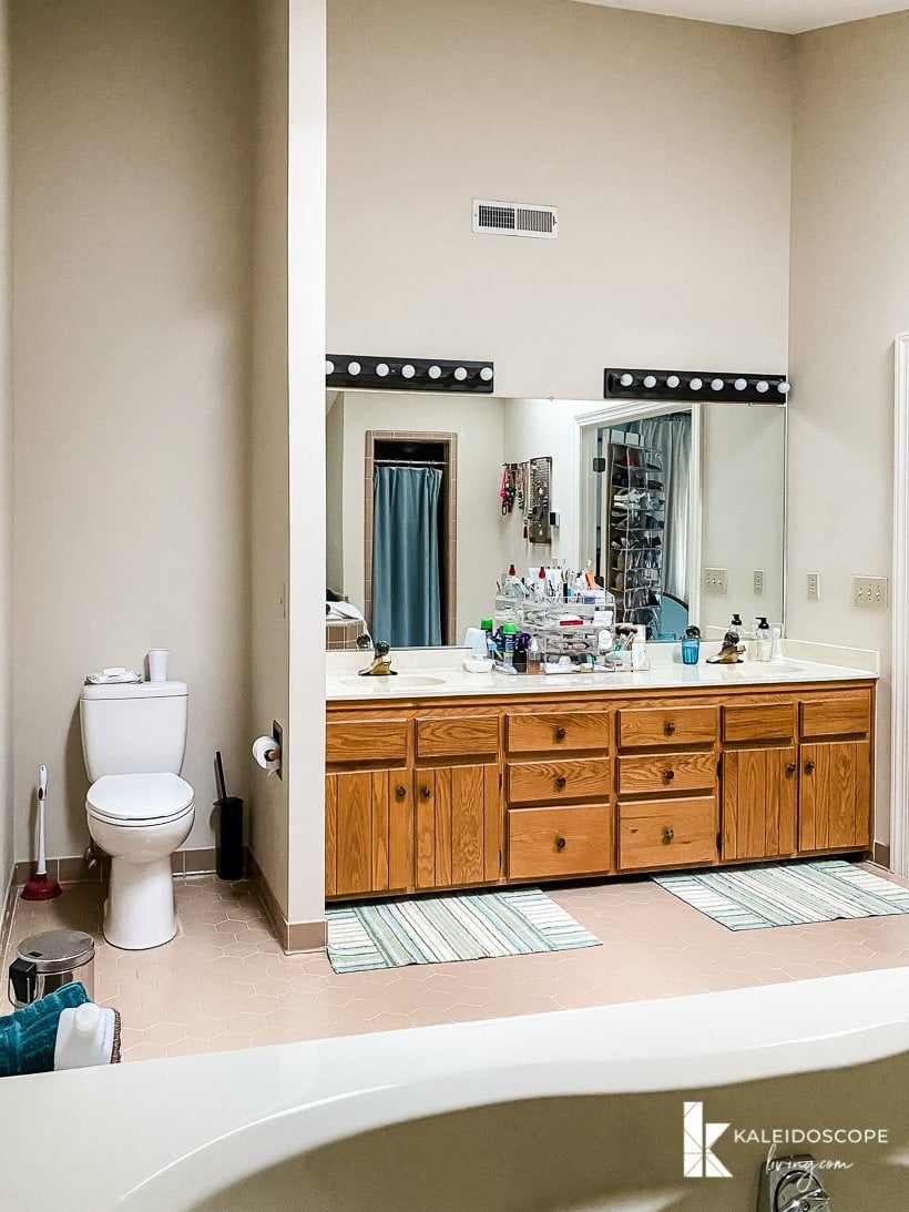 outdated bathroom with wood vanity