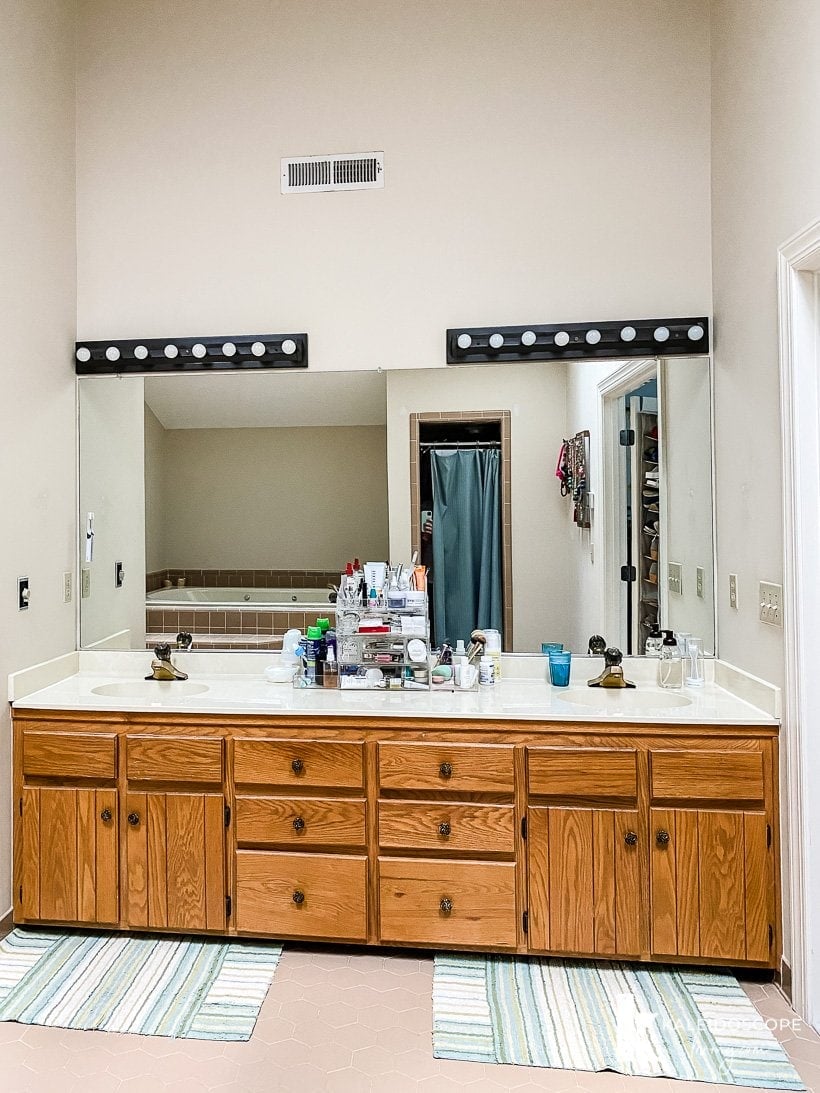 outdated wood vanity and lights