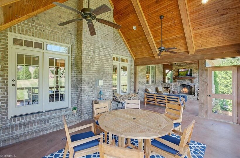 outdoor space with eating area and vaulted ceiling