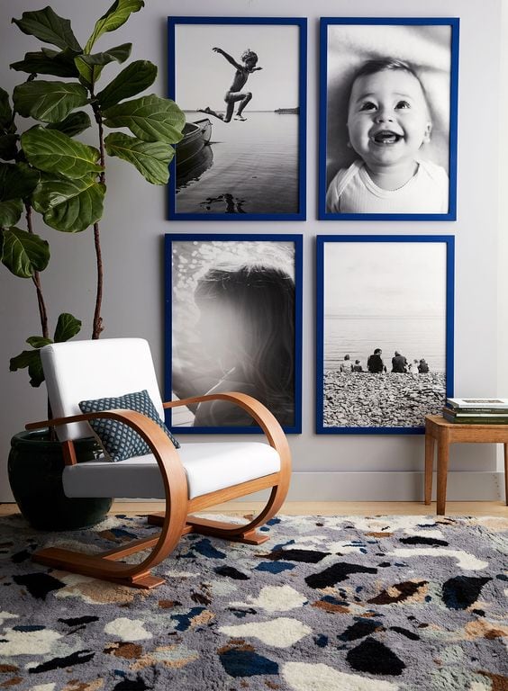 large black and white photos in blue frames