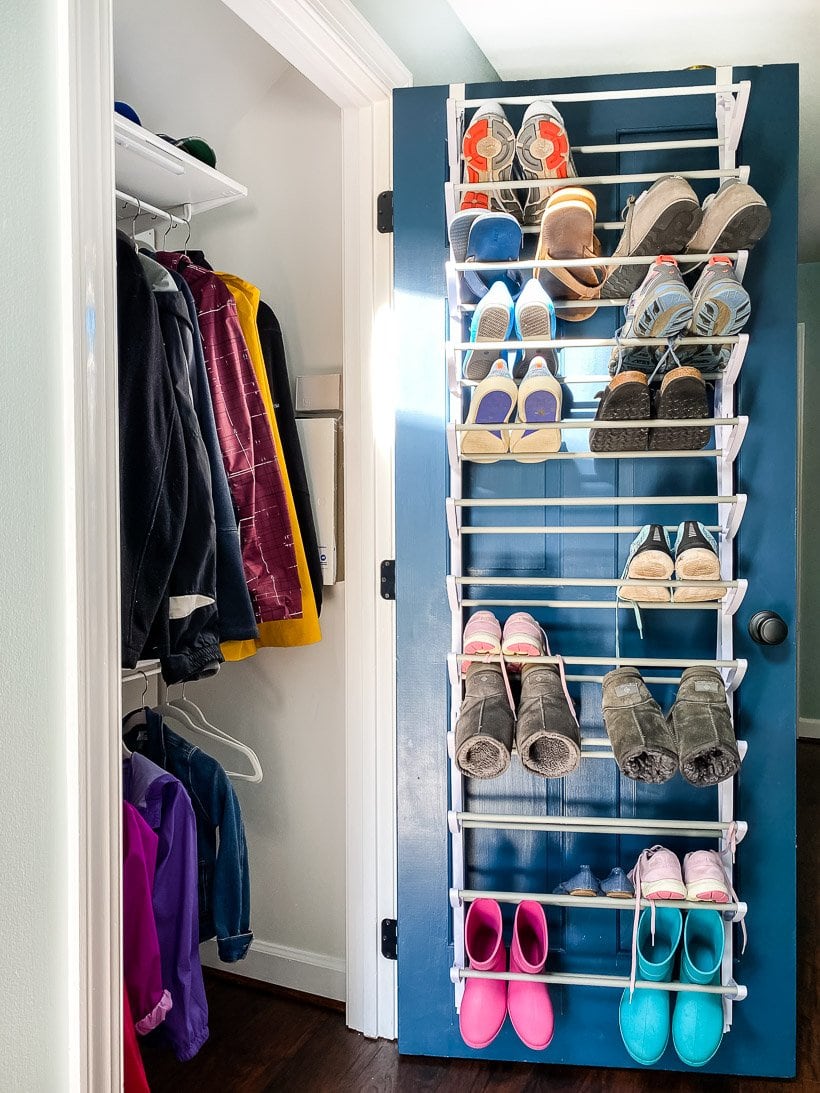 organized coat closet with shoe rack