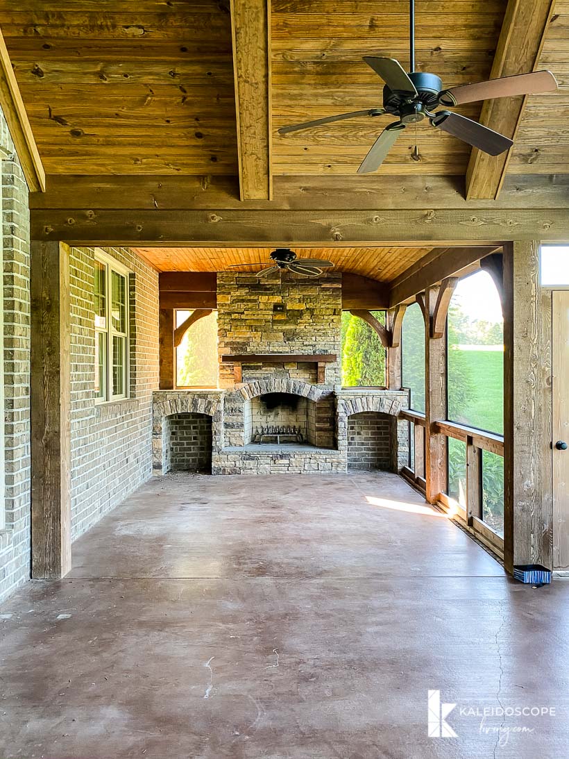 large screened in porch with fireplace