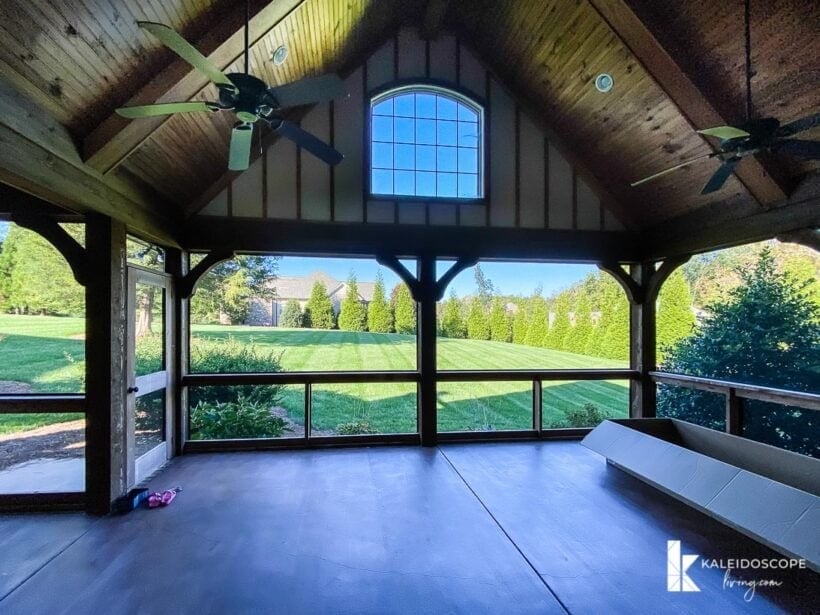 screened in porch with view of back back yard