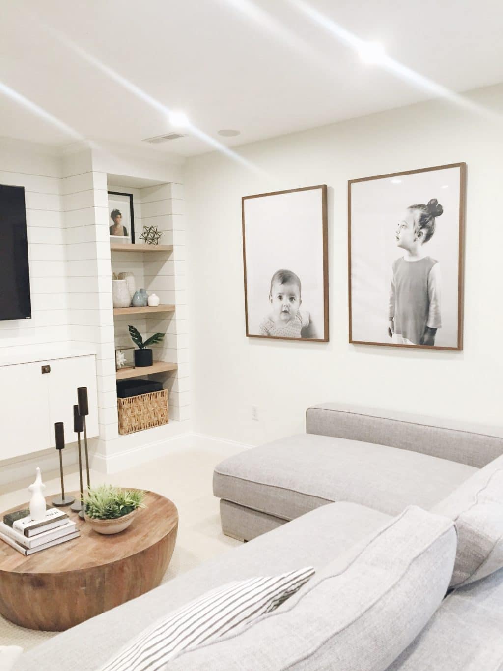 giant minimal portraits in neutral family room