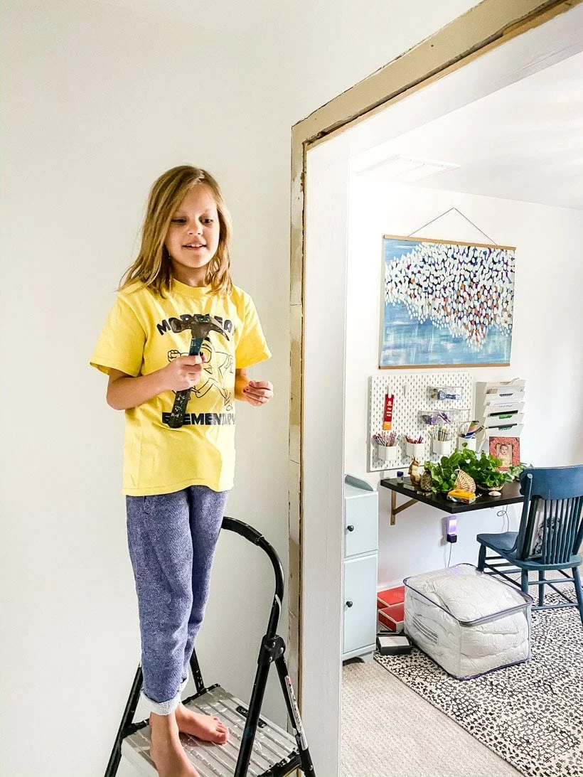 child helping with home improvement project