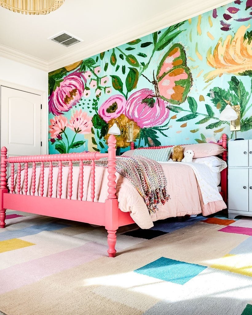 area rug on top of carpet in colorful girl's bedroom designed by Tasha Agruso of Kaleidoscope Living