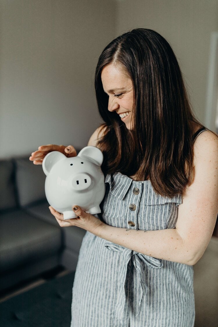 woman holding piggy bank