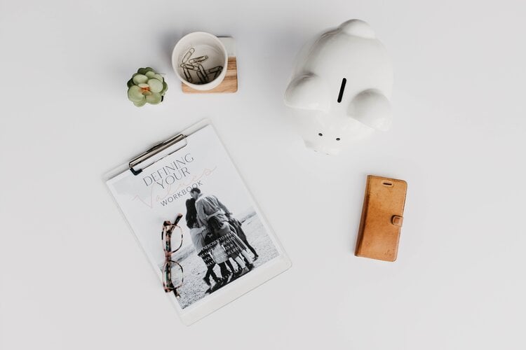 budgeting workbook and piggy bank