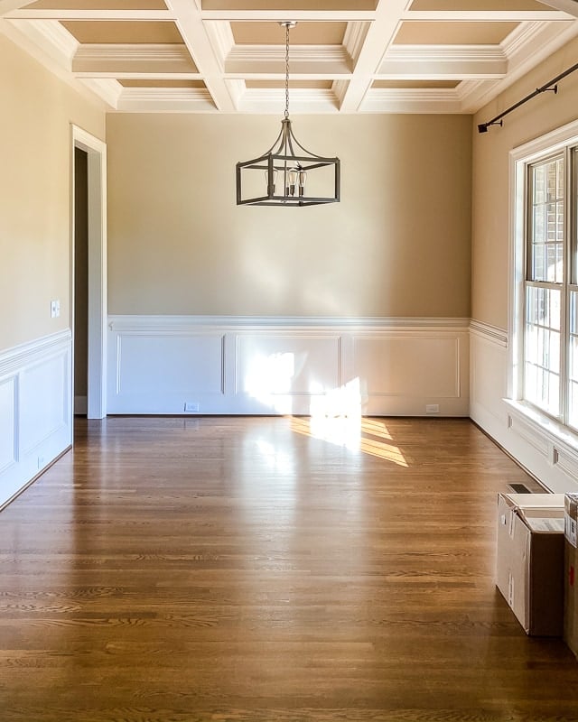 beige dining room with coffered ceiling