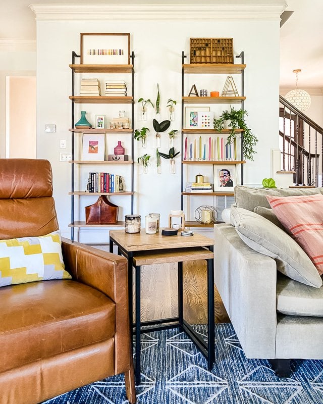 Colorfully styled shelves in living room.