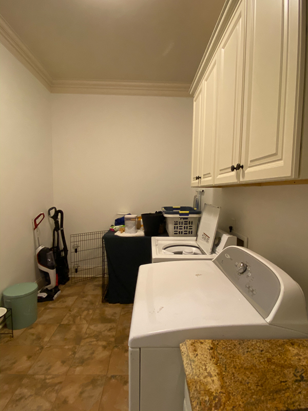 outdated laundry room before makeover