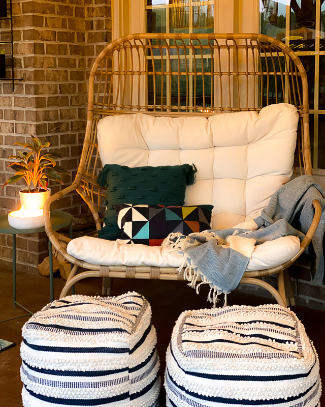 screened-in-porch with egg chair at night