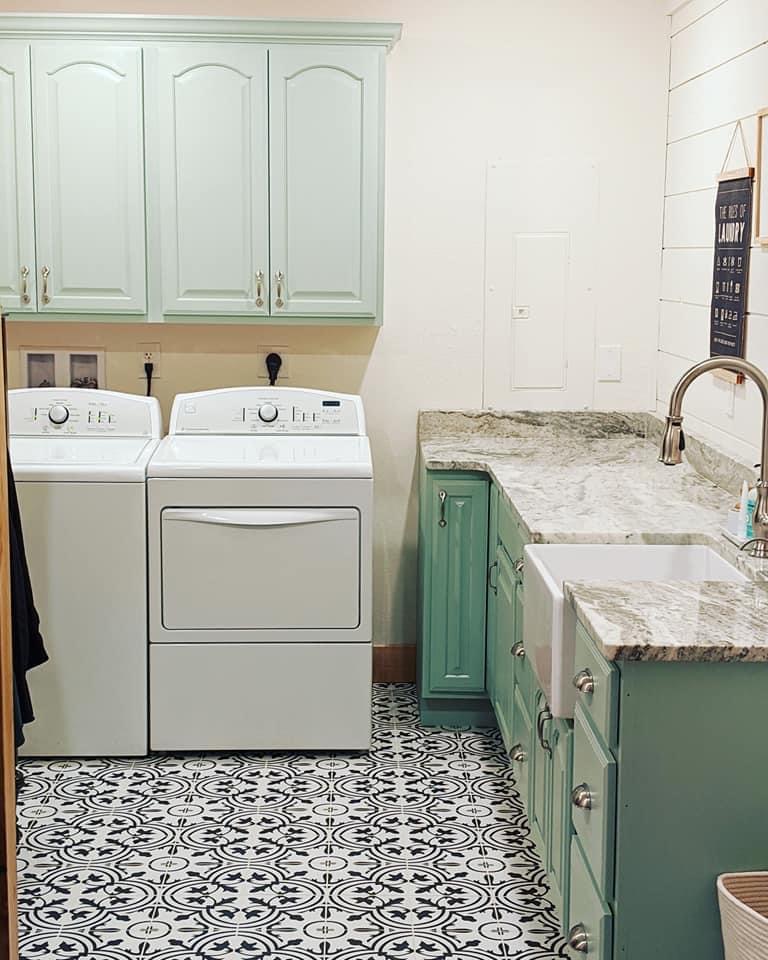 laundry makeover with painted cabinets and marble counter