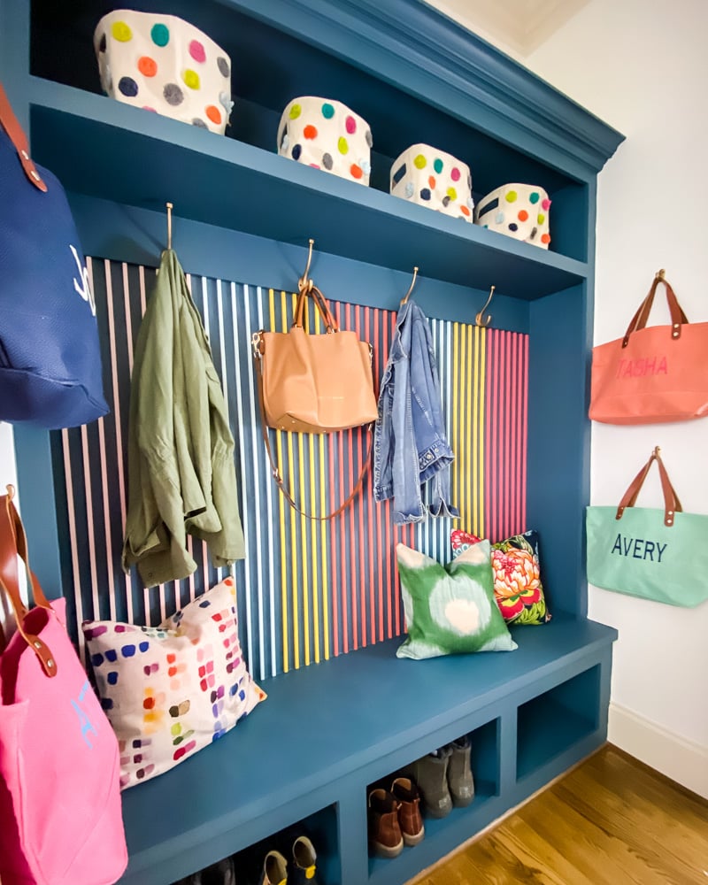 colorful mudroom with slat wall