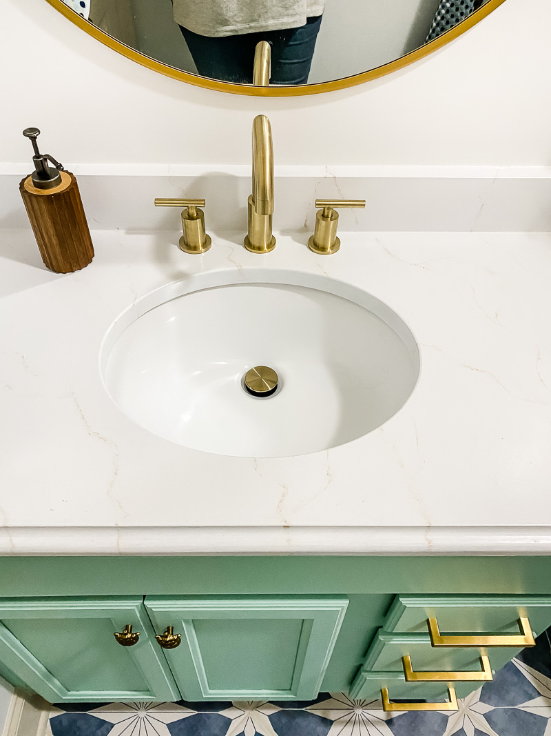updated vanity with countertops painted to look like marble in girl's bathroom