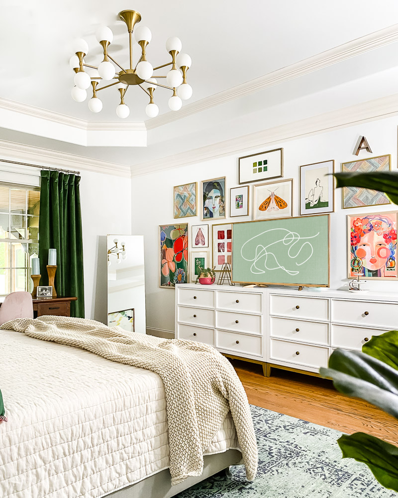 colorful bedroom with gallery wall and frame TV