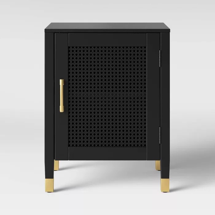 black caned nightstand with gold accents