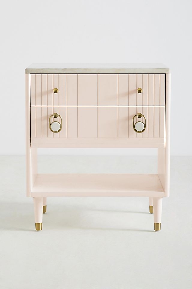 pink bedside table with gold accents