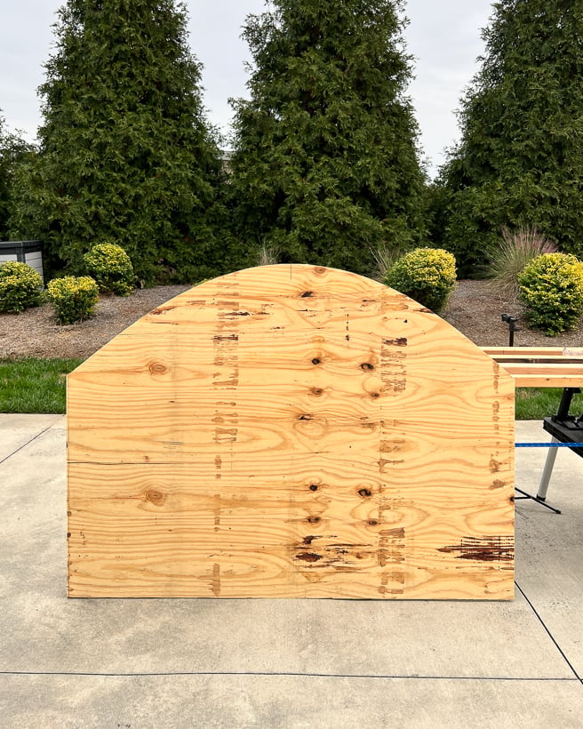 arched headboard cut out of plywood