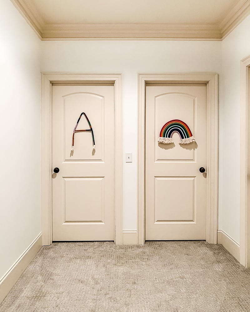 plain bedroom doors side-by-side in hallway