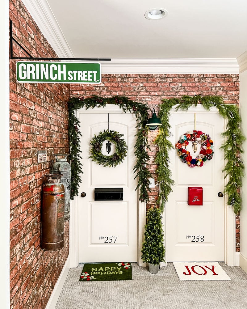 hallway doors made to look like exterior apartment doors at Christmas