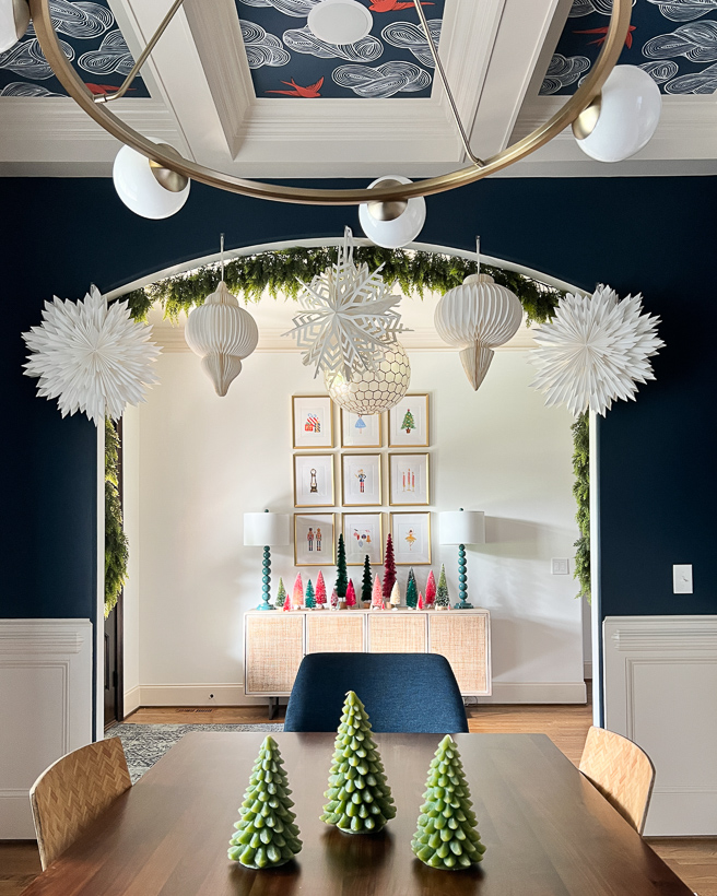 Christmas aesthetic - Photo of dining room and entryway with colorful accents and bottlebrush trees decorated for Christmas by Tasha Agruso of Kaleidoscope Living