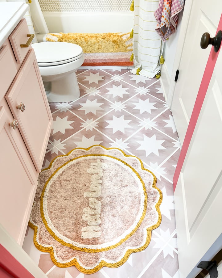 tile stickers on floor in girl's bathroom