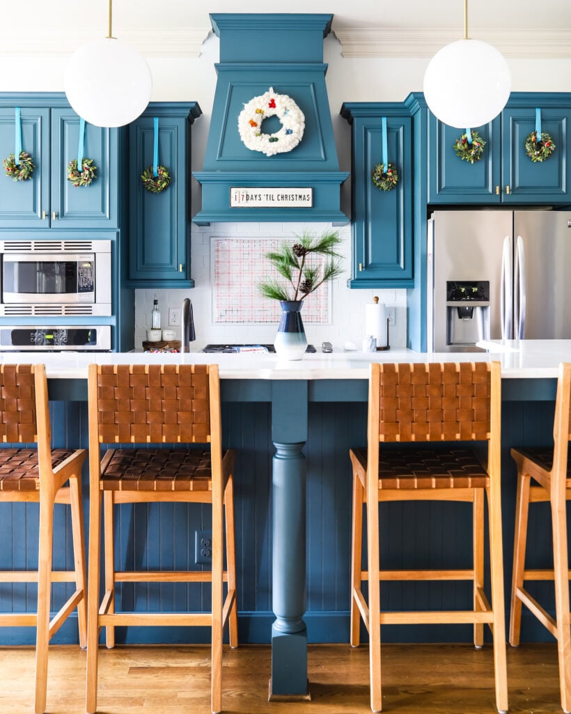 Christmas aesthetic - Photo of kitchen with mini wreaths on cabinets by Tasha Agruso of Kaleidoscope Living