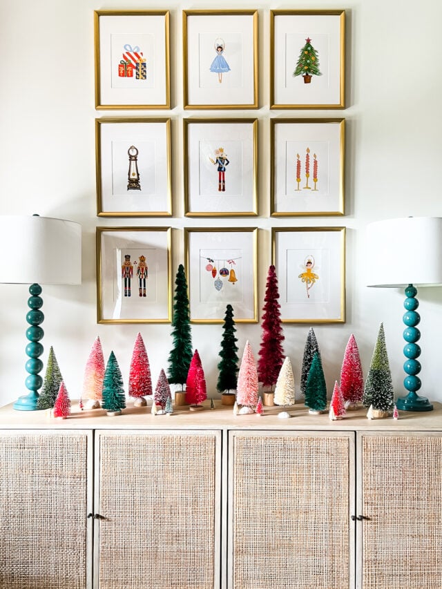 Christmas aesthetic - Photo of colorful entryway decorated for Christmas with Christmas art and bottlebrush trees by Tasha Agruso of Kaleidoscope Living