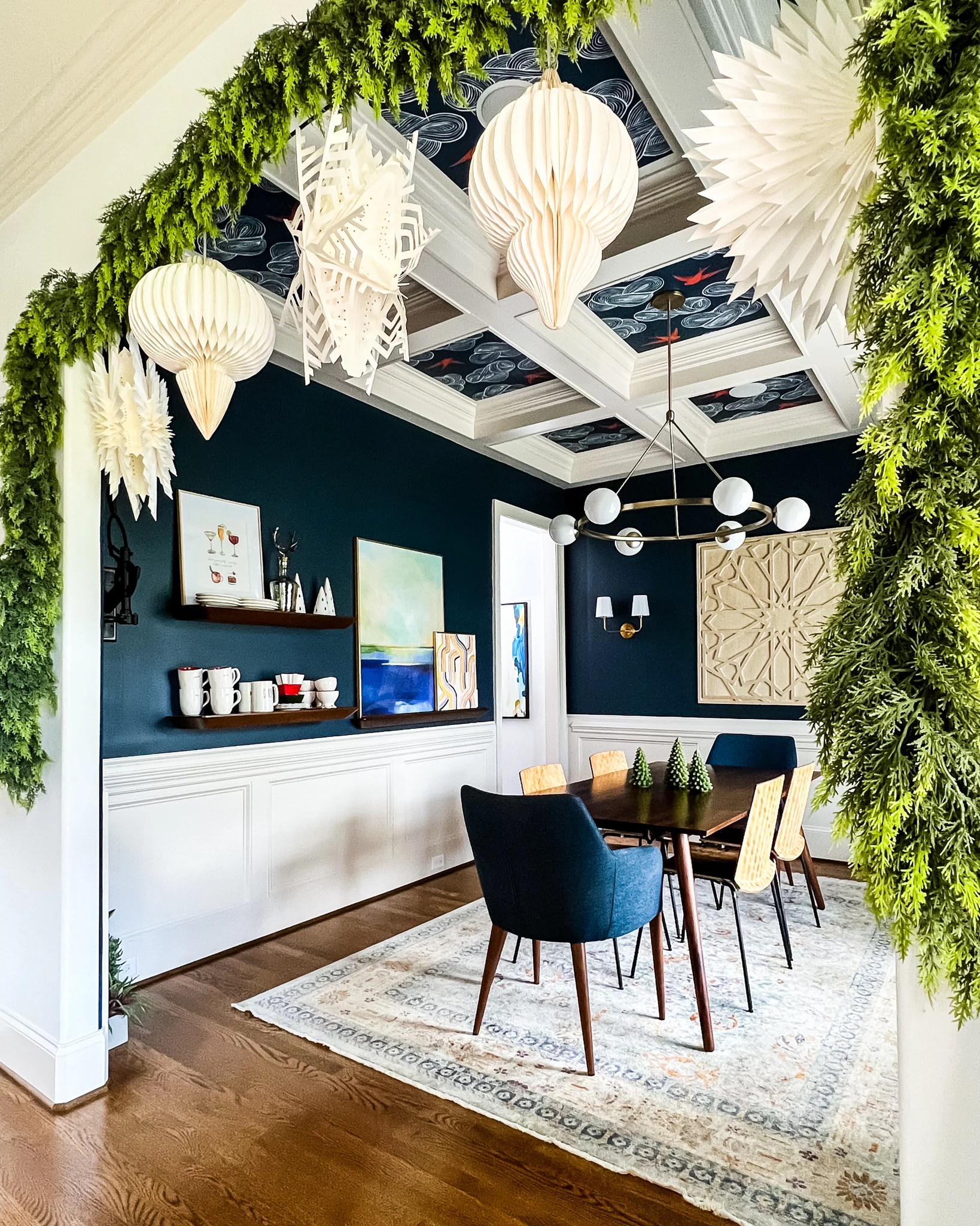 faux cedar garlands hanging in dining room entryway