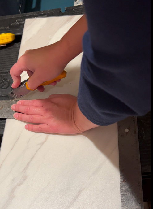 cutting luxury vinyl tile with utility knife