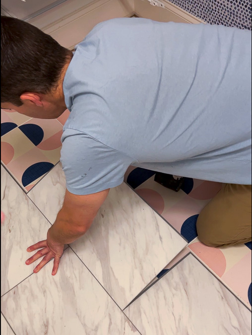 floating floor installation of luxury vinyl tile that looks like marble