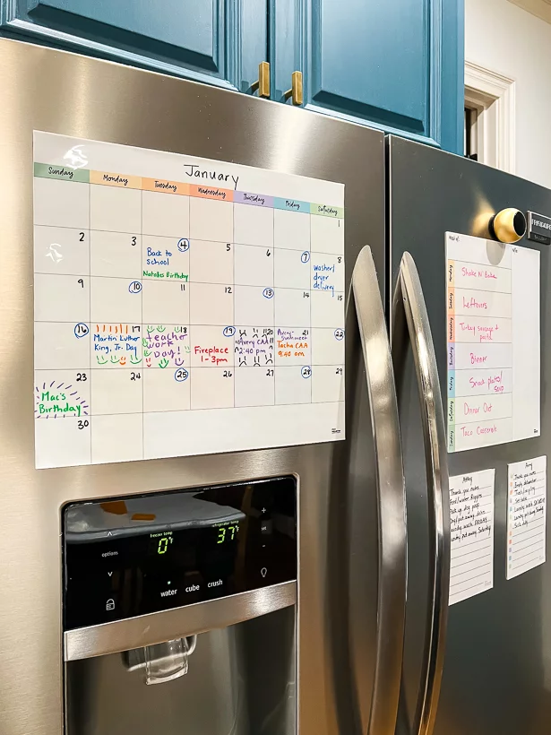 A family command center made from MC Squares calendar on the refrigerator.