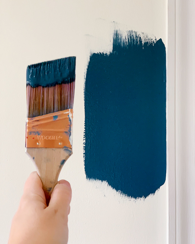 photo of sample of navy blue paint on wall