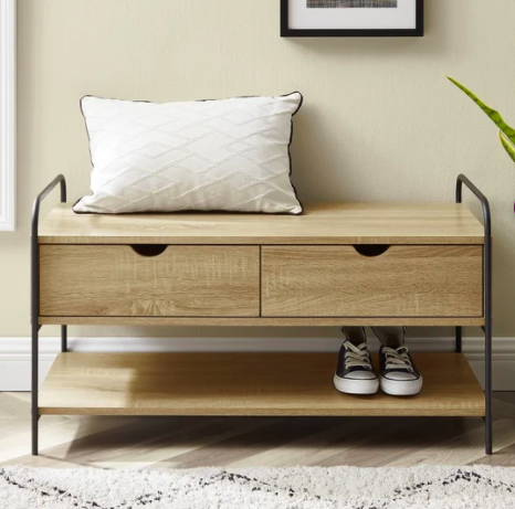 small wood bench with metal legs with pillow on top and shoes on shelf 