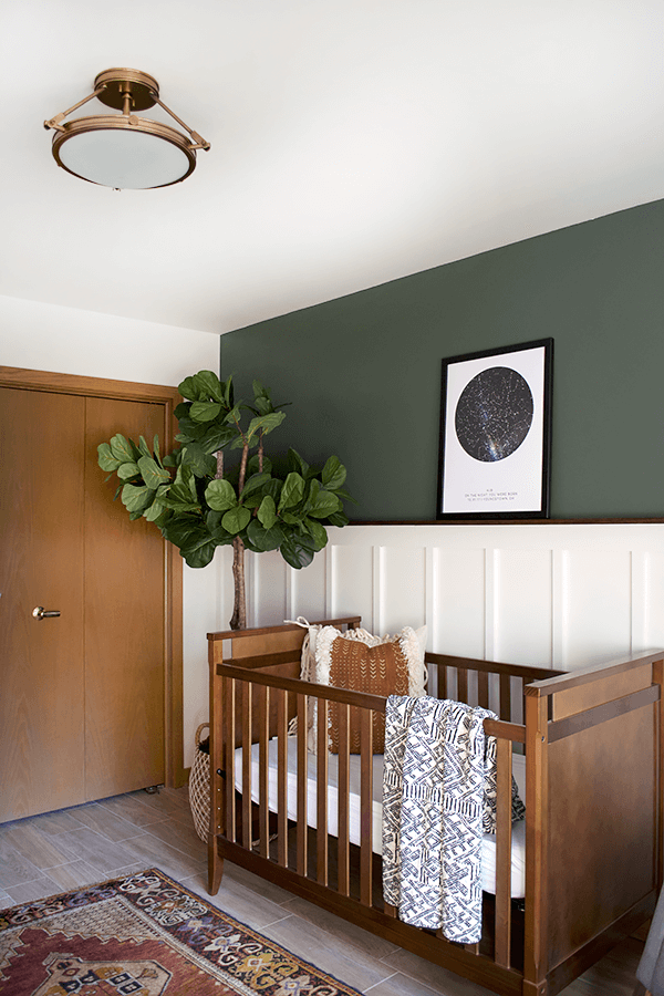 modern nursery with white board and batten and olive walls