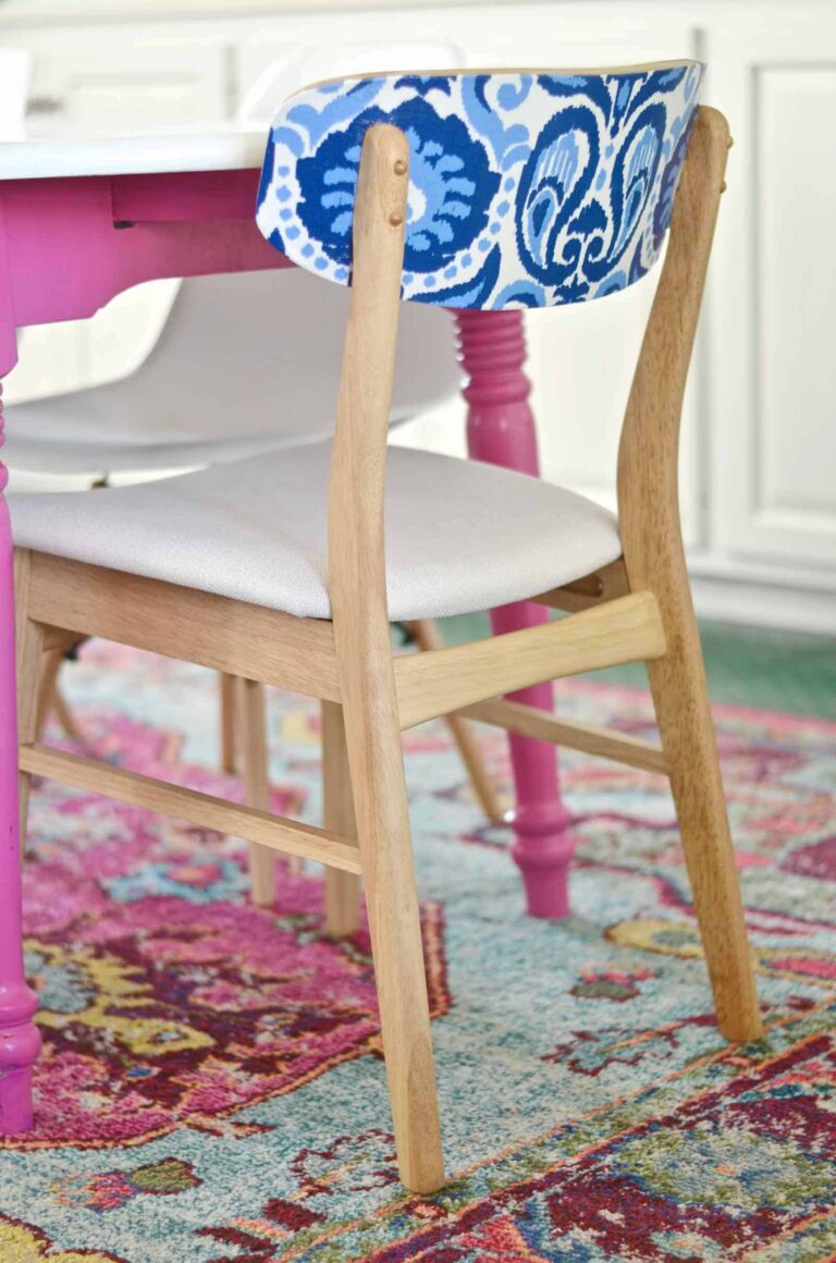 blue and white decoupaged kitchen table chair at pink table 