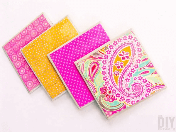 colorful craft paper decoupaged on coasters