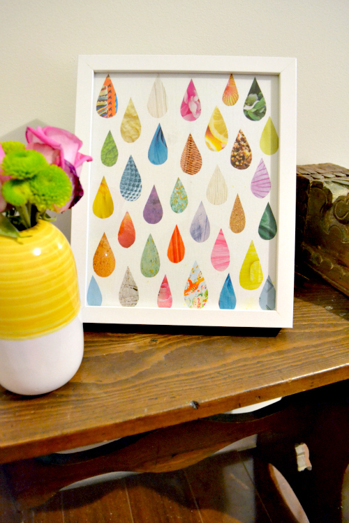 small framed art with colorful decoupaged paper raindrops on white background 
