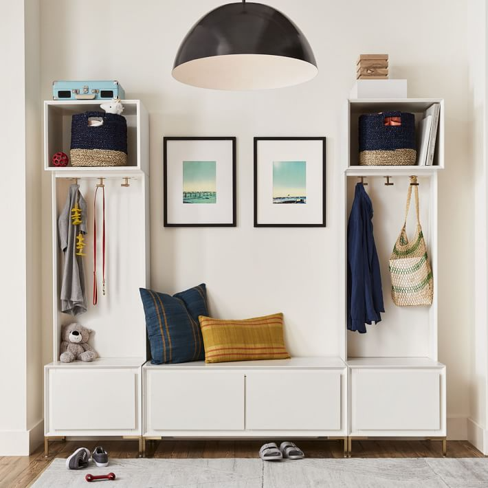 white modular entry storage lockers with drawers and bench with pillows