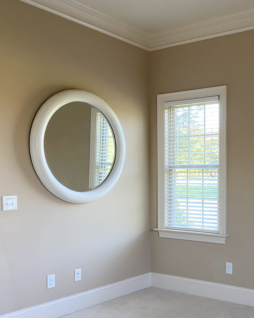 white round wood mirror