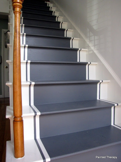 white and grey painted runner on stairs