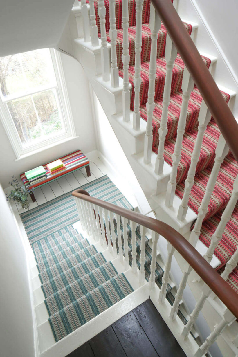 contrasting runners on three story stair case