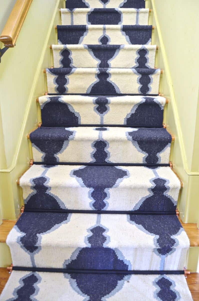 budget friendly blue and white runner with stair rods