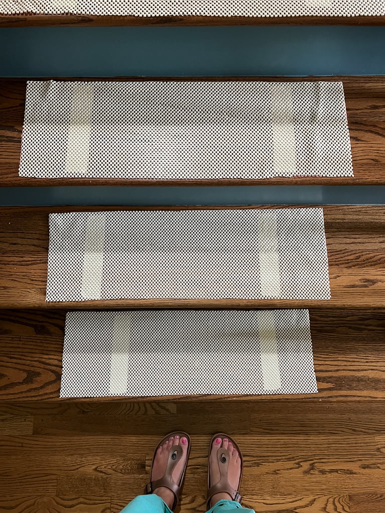 https://designertrapped.com/wp-content/uploads/2022/06/diy-stair-runner-installation-03.jpg